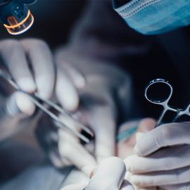 Surgeons performing surgery. 