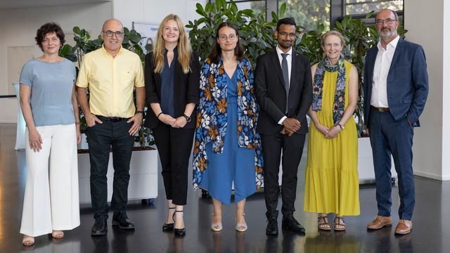 Group photo of Eppendorf Award recipients and organizers standing together indoors. 