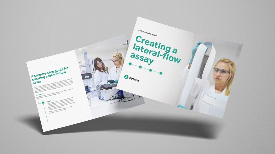Cytiva eBook cover and inside page showing a step-by-step guide for creating a lateral-flow assay with images of scientists in a lab