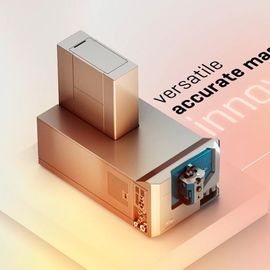 Modern mass spectrometer on a lit platform with the words “versatile,” “accurate mass,” and “innovation” in the background 