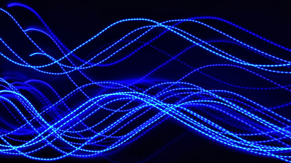 Blue LED light strips in a dark environment.